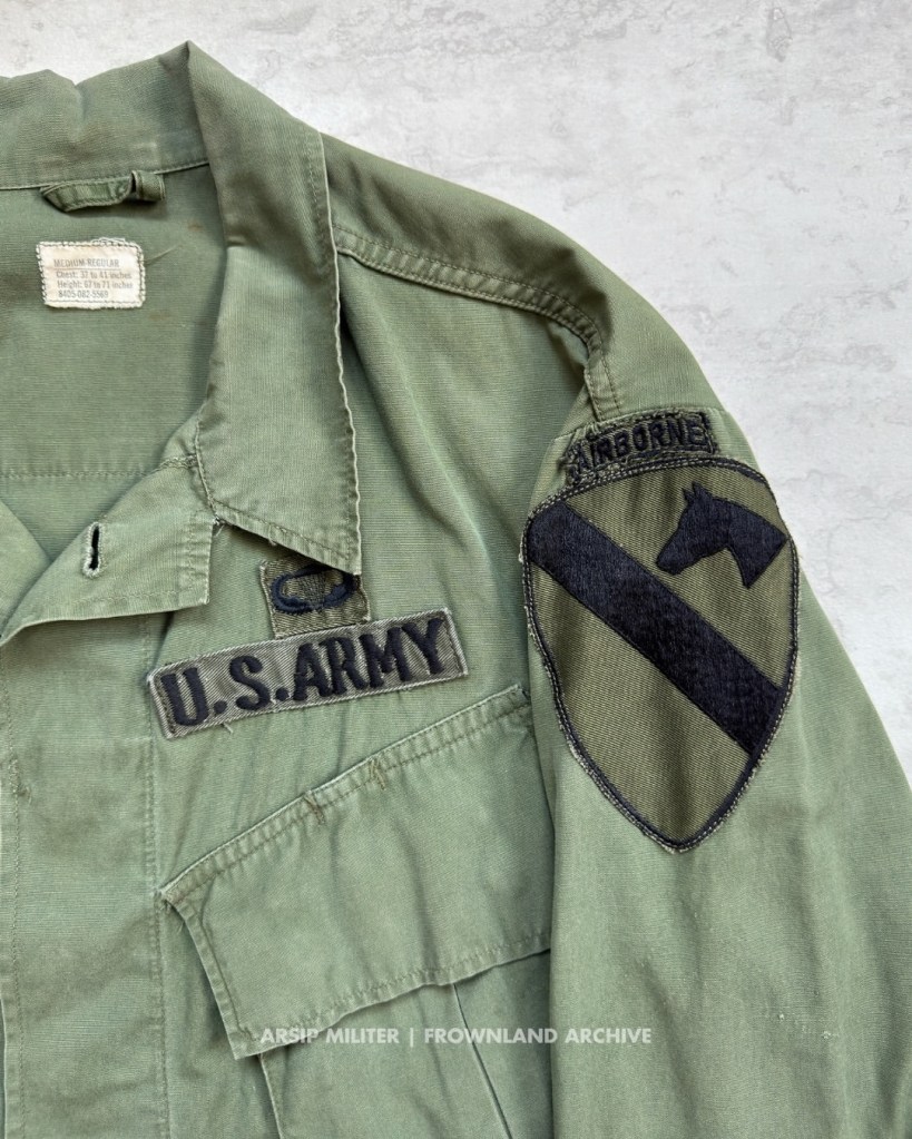 Jungle jacket belonged to Howard of the 1st Brigade, 1st Cav. Div. (Airmobile). The 1st Brigade consisted of three battalions: 1/8 Cavalry, 2/8 Cavalry, and 1/12 Cavalry. Although these units eventually lost their airborne status, some personnel continued to wear AIRBORNE tabs and jump wings, reflecting the brigade’s airborne heritage. Also included are two period photographs showing the personnel still wearing the AIRBORNE tab. DSA 100-67-C-3153